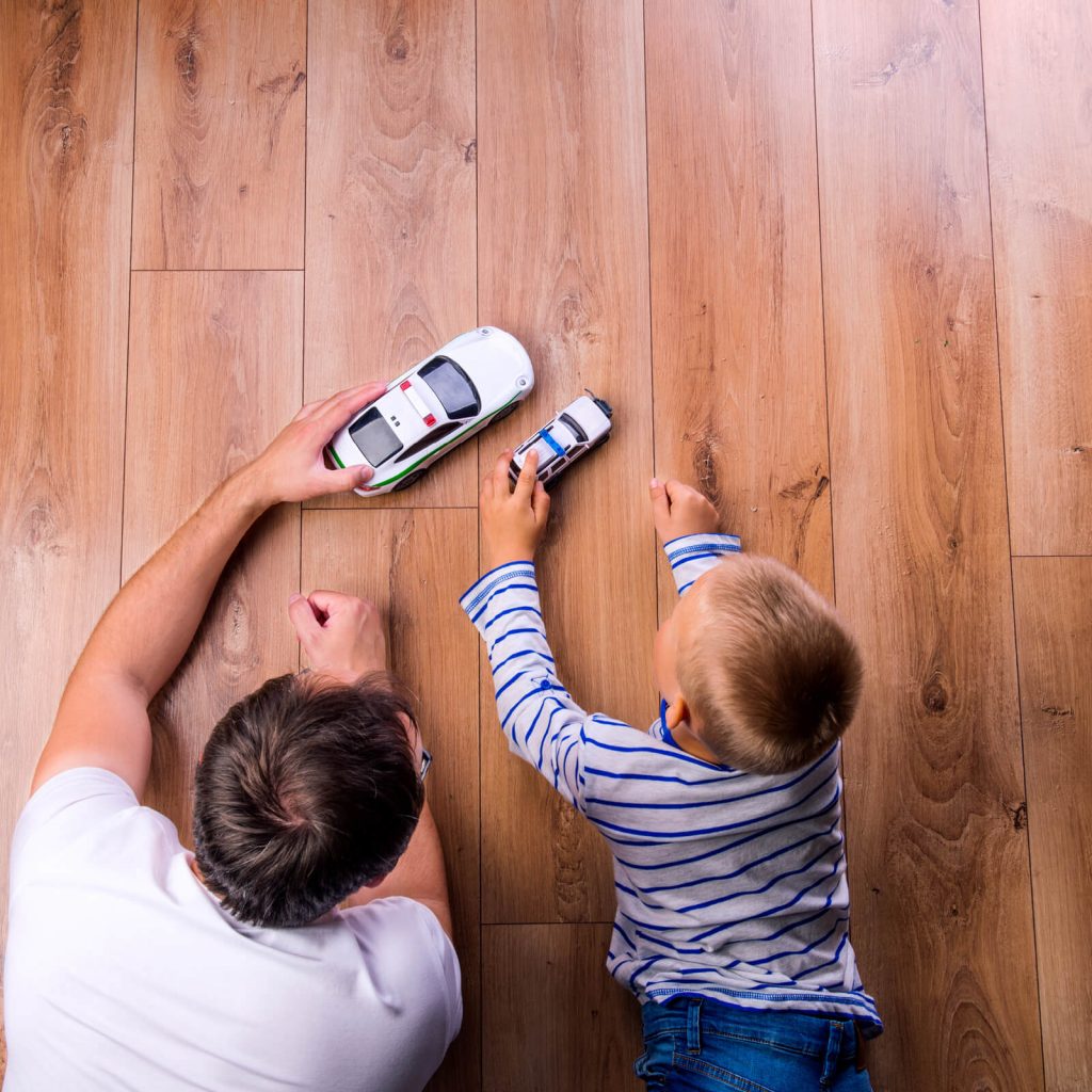 Father with kid playing with toycar | The Carpet Stop