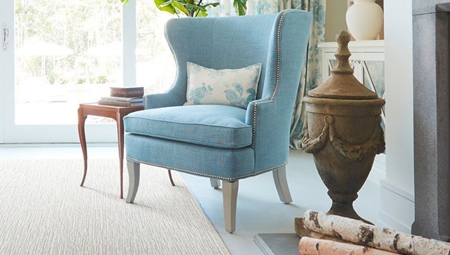 Living room carpet flooring with blue couch | The Carpet Stop