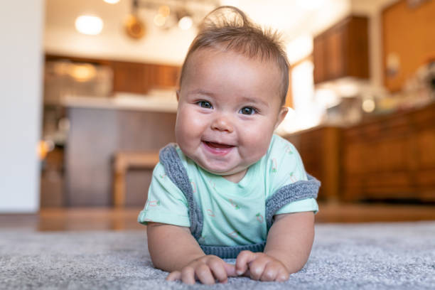 Baby lying on carpet flooring | The Carpet Stop